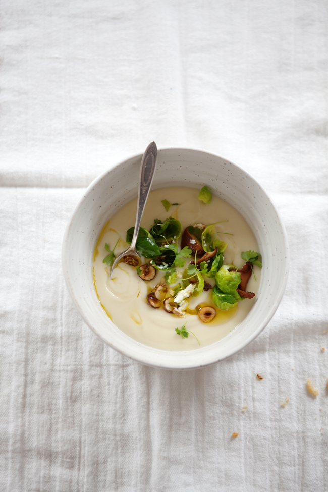 Celery root soup with Brussels sprouts, chanterelles  and hazelnuts